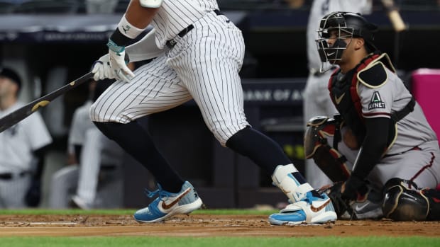 Detailed view of Aaron Judge's blue, white, and red Air Jordan cleats.